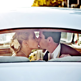 wedded couple departing in car