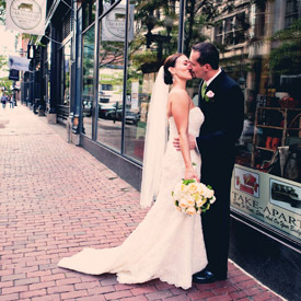 bride and groom street kiss